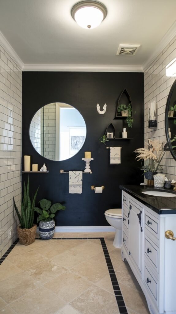 a bathroom with a black accent wall. The black wall is adorned with various items such as a large, round mirror, a few decorative candles, a few potted plants, and a few shelves with decorative items. The floor is tiled with beige and black tiles. The wall opposite the black wall has a white vanity with a sink and a few decorative items. The ceiling has a light fixture.