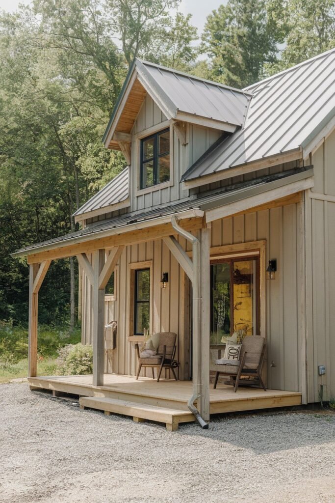 a new cottage exterior with a rustic charm. The cottage has a wooden facade, a slanted roof, and a few windows. There's a wooden porch with a few chairs. The ground is covered with gravel. The background is a lush green forest.