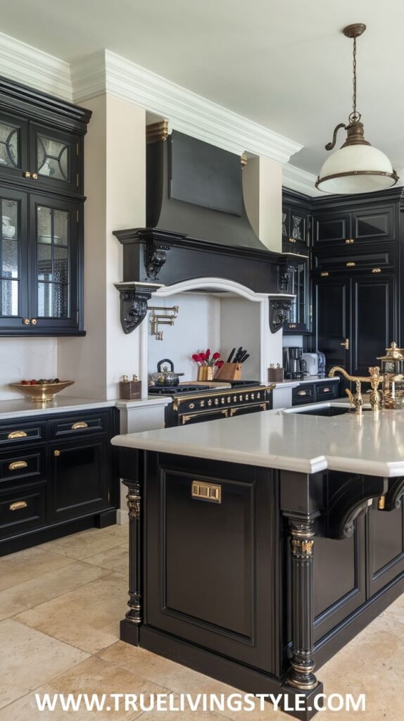 A kitchen with black cabinets, a white countertop island, and gold hardware.