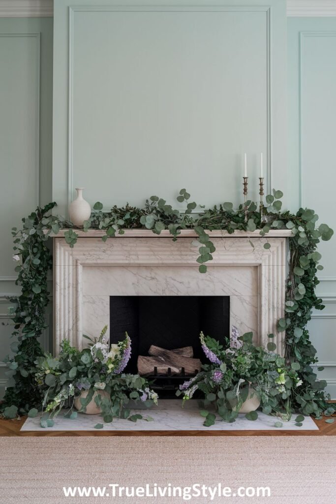 A eucalyptus garland draped across a mantel with white vases and candles for a serene display.