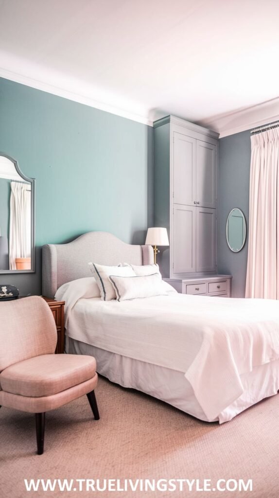 A serene bedroom with teal walls and white trim. A light upholstered bed with white and light pink bedding is shown, along with a light pink armchair.