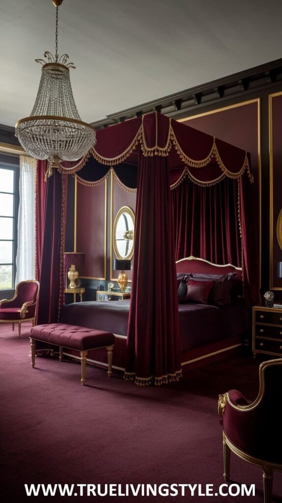 A dramatic dark red bedroom features an opulent dark red four-poster bed with rich, flowing red drapery and gold tassel details. Luxurious velvet and silk fabrics in deep red and purple tones are used for the bedding. A plush dark red bench with gold trim sits at the foot of the bed, and a glimpse of a matching armchair is visible.