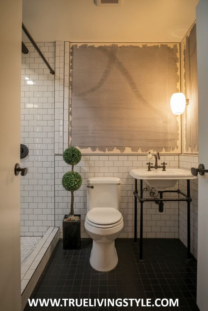 An urban Minimalist Bathroom featuring an industrial-style sink with exposed plumbing and a contrasting dark tiled floor.