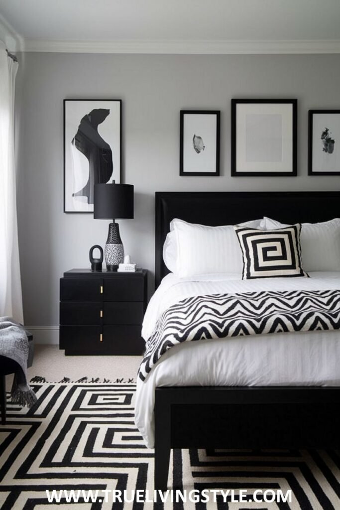 A gallery wall above the bed displays a curated selection of black and white prints in black frames.