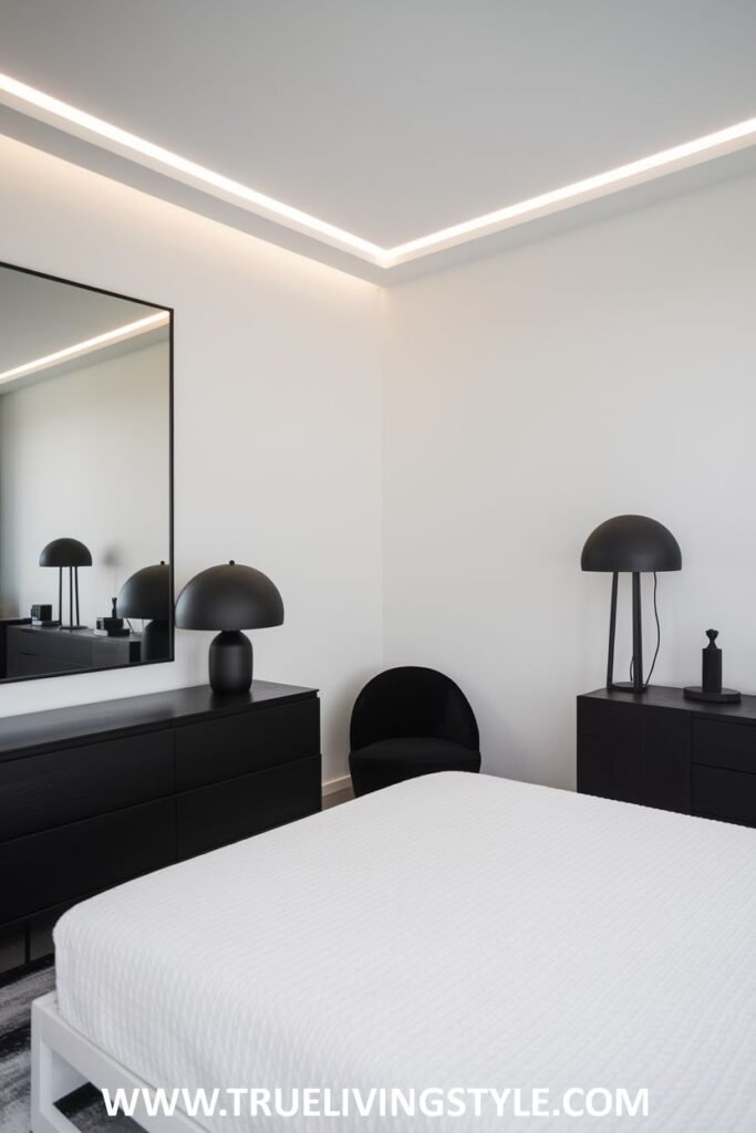 Black dressers are placed on either side of the bed and topped with minimalist lamps.