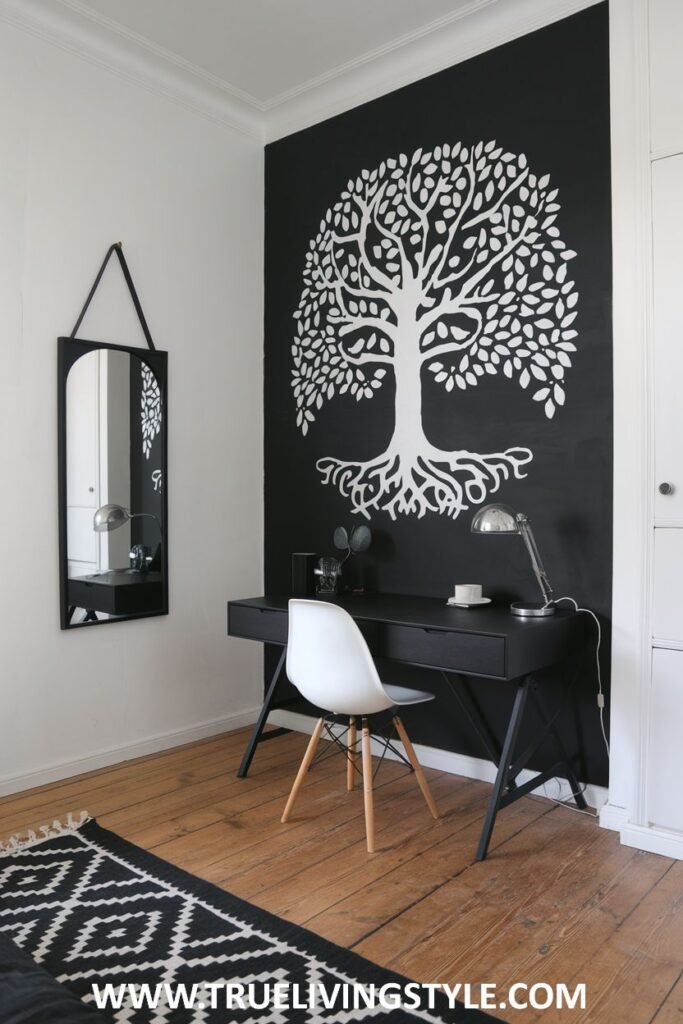 A large wall decal in white on a black wall creates a focal point.