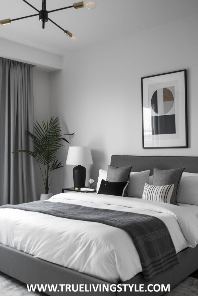 A gray bed frame with black and white accents creates a calming atmosphere.