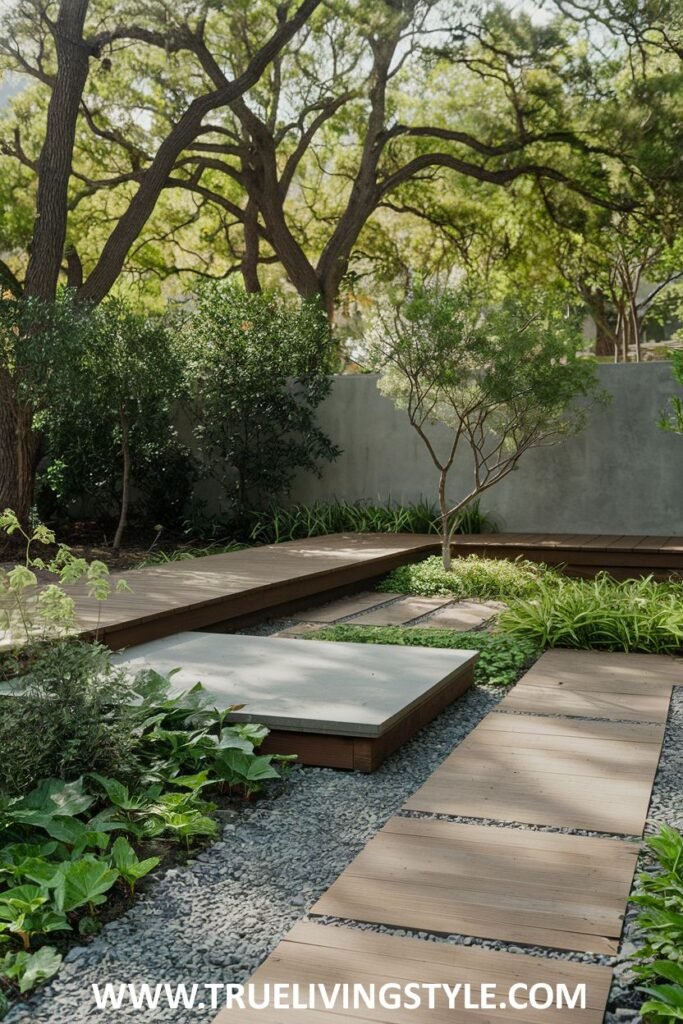 A multi-level garden is constructed with wooden platforms, gravel, and plants.