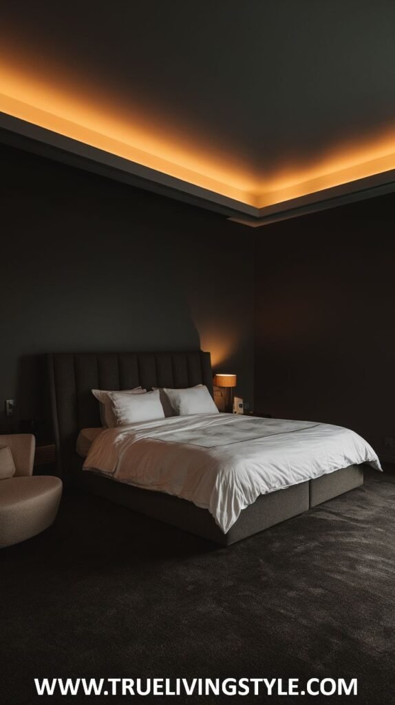 a contemporary dark bedroom with a platform bed, simple white bedding, and warm ceiling lighting.