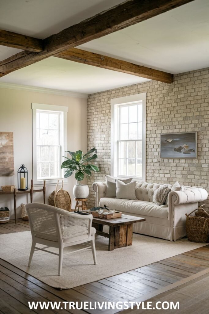 A bright and cozy living room with a white brick wall and neutral furniture.