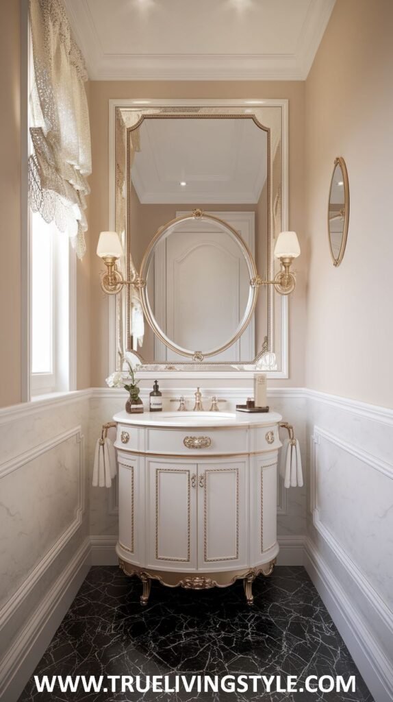 A classic and sophisticated luxury powder room featuring marble wainscoting, a decorative mirror with flanking sconces, a white vanity with intricate gold detailing and fixtures, and a striking black marble floor.