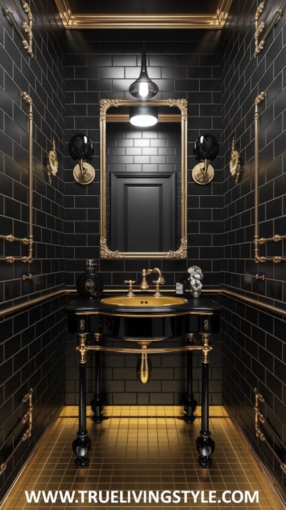 A dramatic and bold luxury powder room with black subway tiles complemented by striking gold accents in the mirror frame, wall-mounted fixtures, and plumbing. A black vanity and a unique gold-tiled floor complete the look.