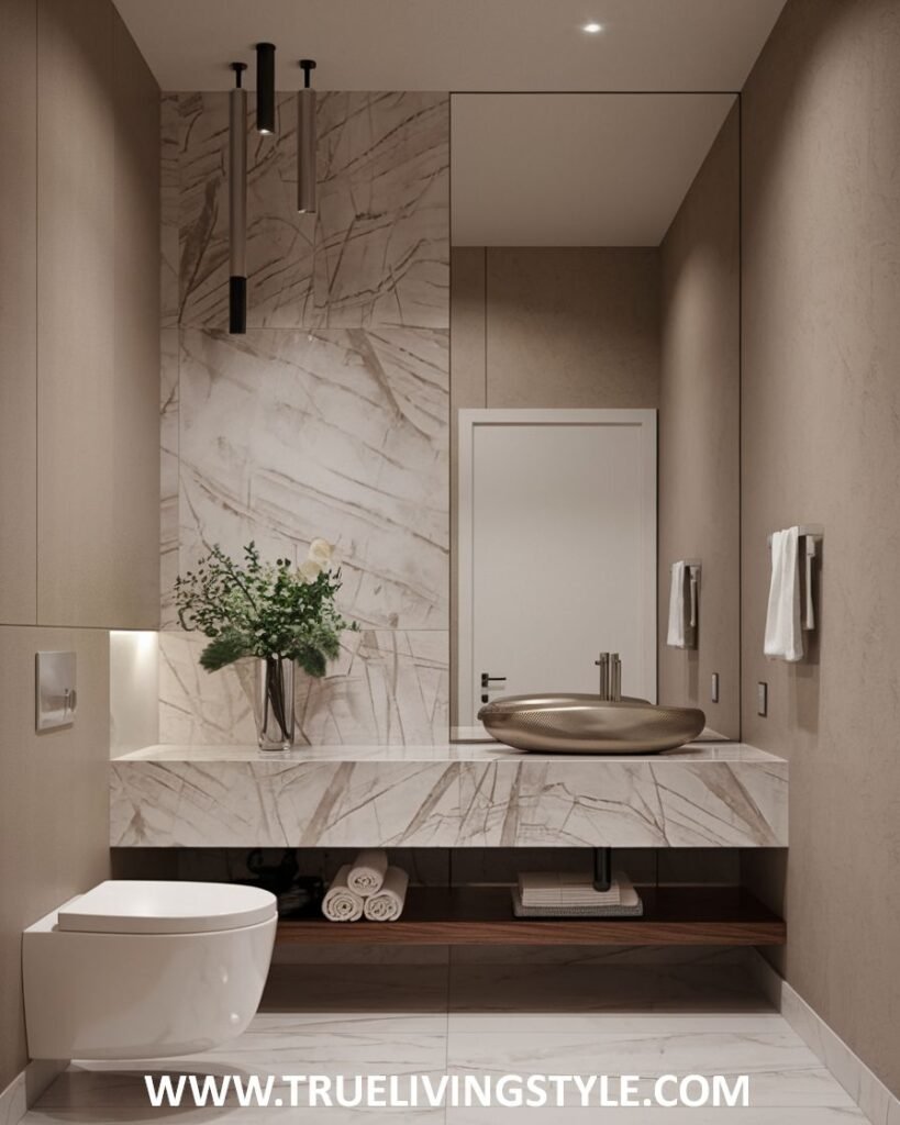 A modern and minimalist luxury powder room showcasing a marble wall and countertop with a unique vessel sink. A floating wooden shelf is visible beneath the countertop, and a toilet is included in the design.