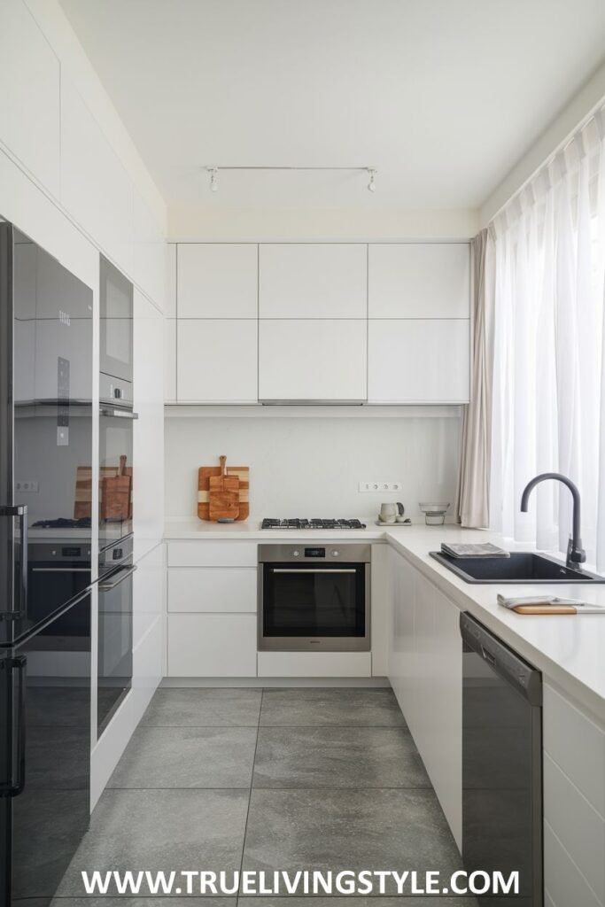 A kitchen with sheer curtains for natural light.