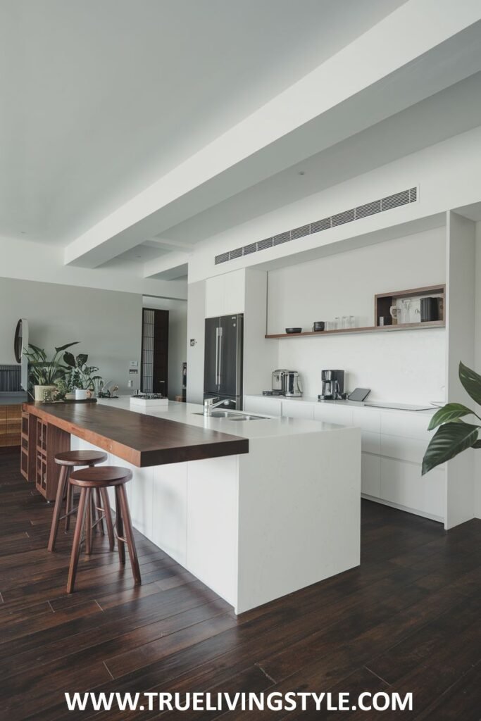 A kitchen island with a wooden countertop extension.