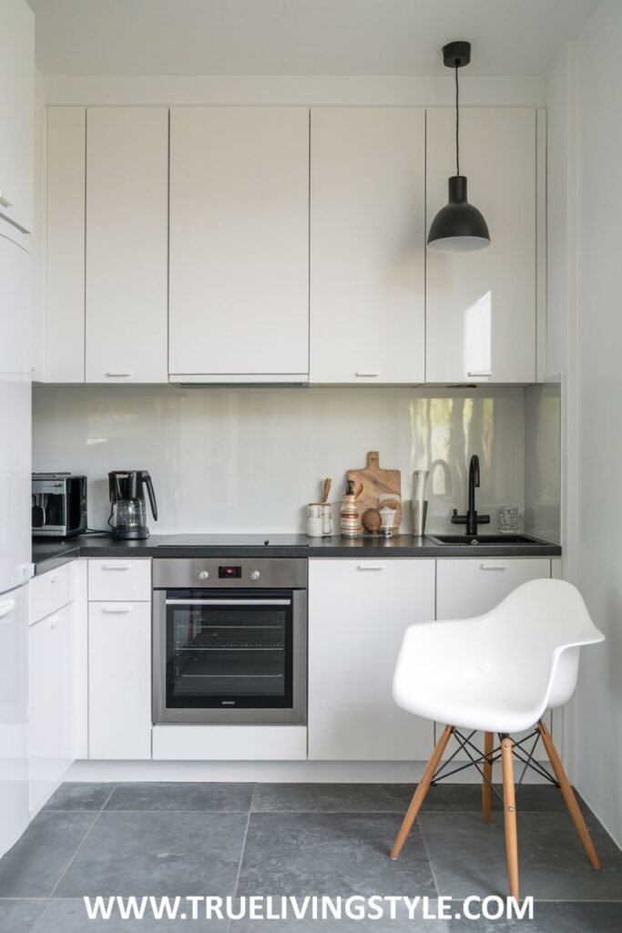 A kitchen with a black pendant light.