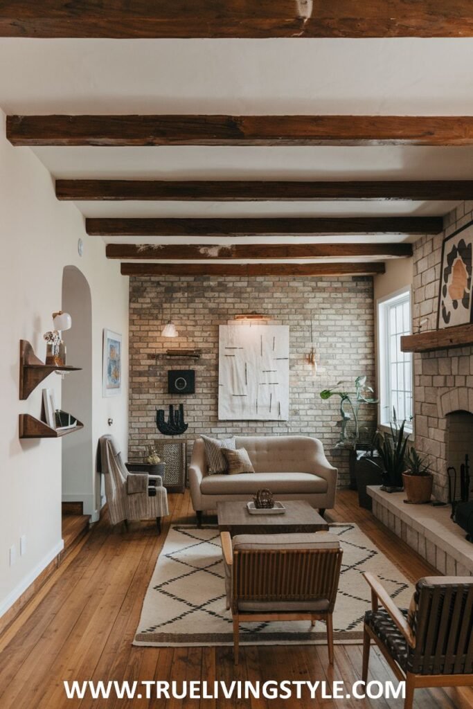 Living room featuring brick walls, wooden ceiling beams, and a fireplace.