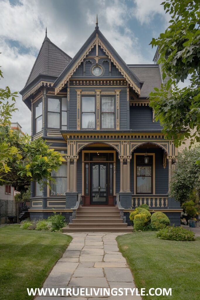 A blue and gold house with a turret and ornate porch has a stone walkway and manicured lawn.